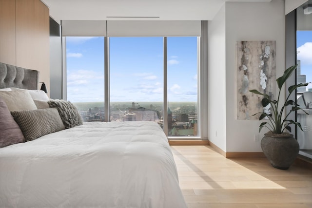 bedroom with light hardwood / wood-style flooring