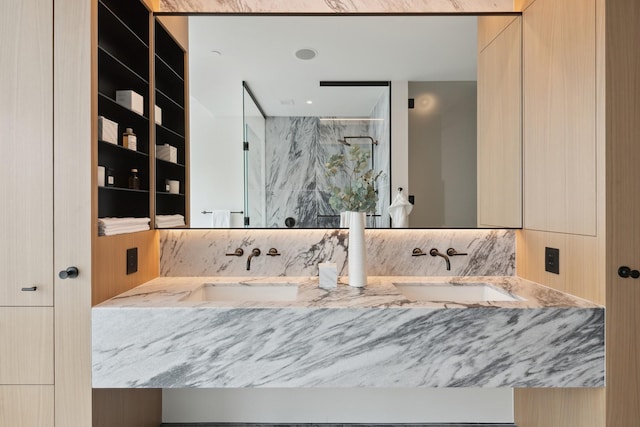 bathroom with vanity and walk in shower