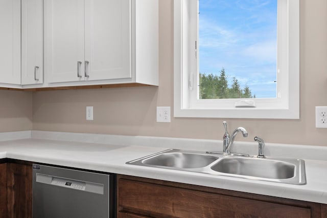 kitchen with dishwasher, dark brown cabinets, white cabinets, and sink