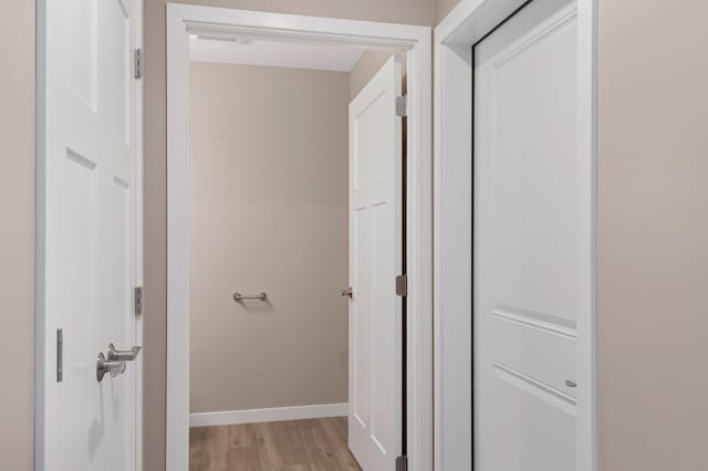 corridor featuring light hardwood / wood-style flooring