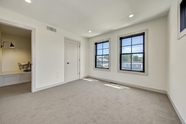 unfurnished bedroom featuring light colored carpet