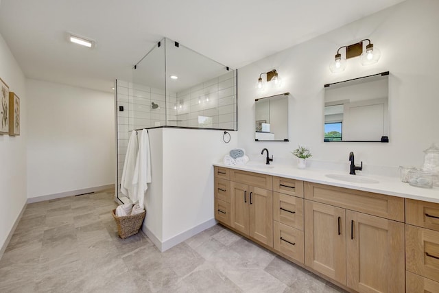 bathroom featuring tile flooring, tiled shower, and dual bowl vanity