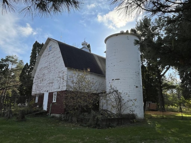 view of home's exterior featuring a yard