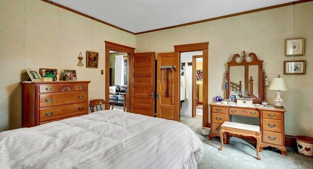 carpeted bedroom with crown molding