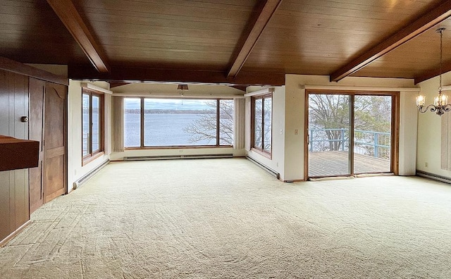 interior space featuring an inviting chandelier, beam ceiling, and a wealth of natural light