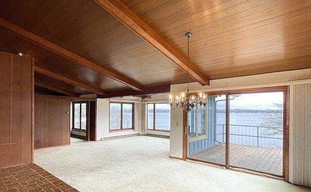 carpeted spare room with wooden ceiling, a notable chandelier, vaulted ceiling with beams, and a water view