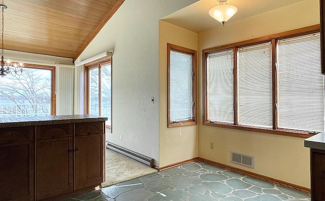 17850 Cedar Park Loop, Fergus Falls, MN 56537 - kitchen featuring a baseboard heating unit, carpet floors, baseboards, a chandelier, and lofted ceiling