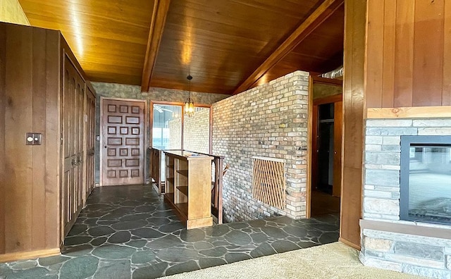 17850 Cedar Park Loop, Fergus Falls, MN 56537 - interior space featuring wooden ceiling, beam ceiling, wooden walls, baseboards, and stone flooring