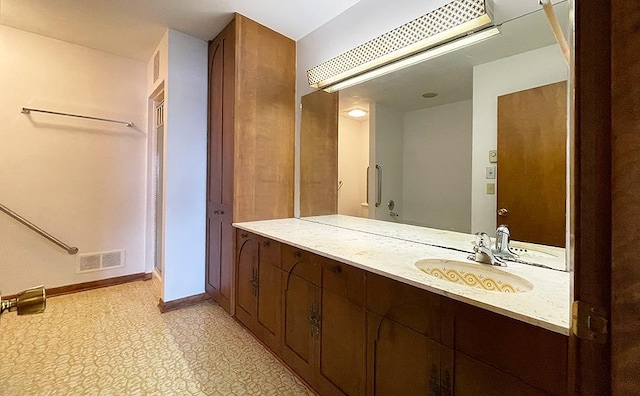 bathroom featuring tile floors and oversized vanity