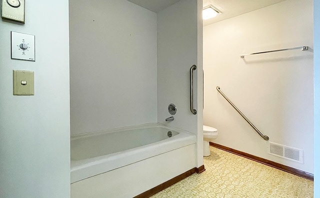 bathroom featuring shower / bath combination, tile floors, and toilet