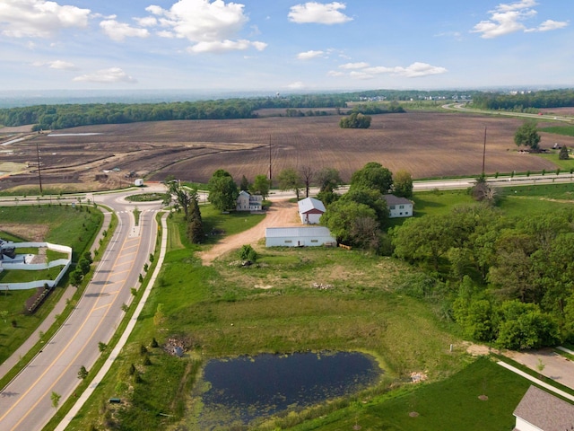 birds eye view of property featuring a rural view and a water view