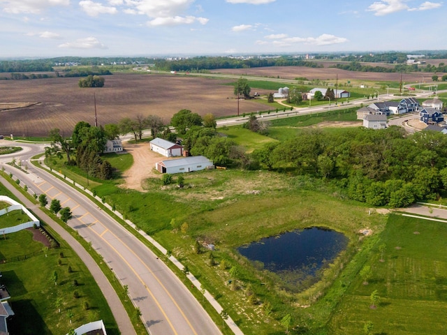 bird's eye view with a rural view and a water view