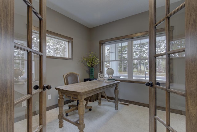 office with french doors, carpet, and a wealth of natural light