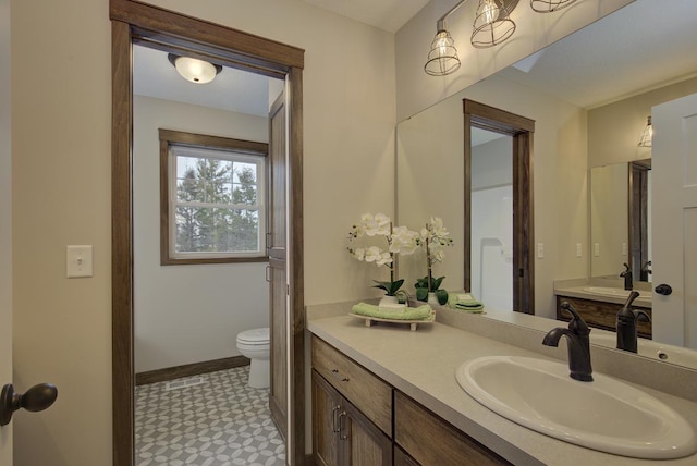 bathroom with vanity and toilet