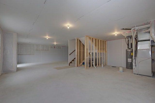 basement with heating unit and electric water heater