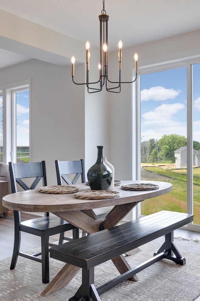 dining area featuring a notable chandelier and wood-type flooring