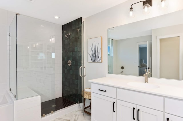 bathroom featuring vanity and walk in shower