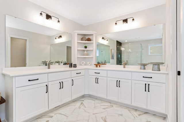 bathroom with vanity and a shower with shower door