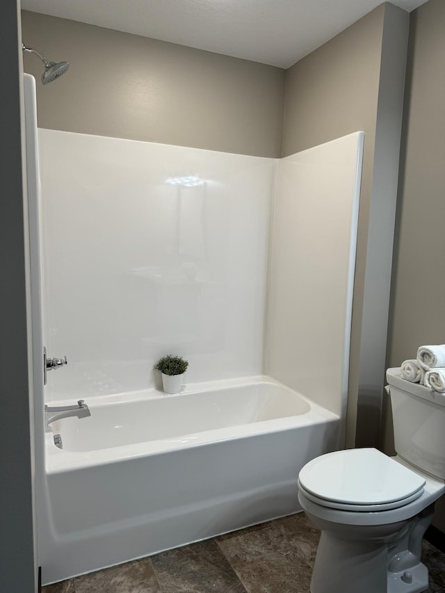 bathroom featuring toilet and shower / washtub combination