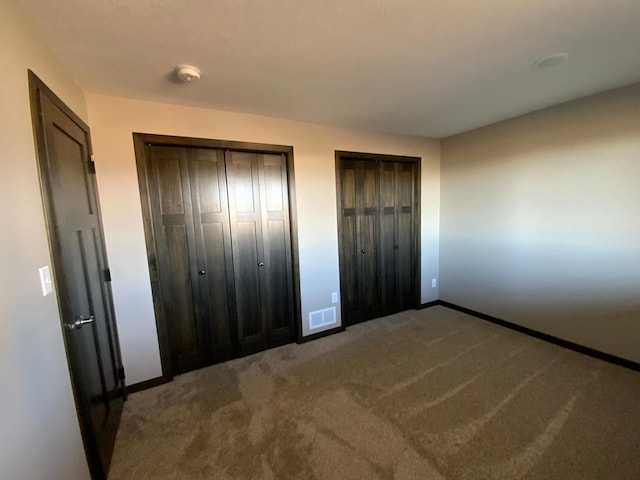 unfurnished bedroom with carpet floors