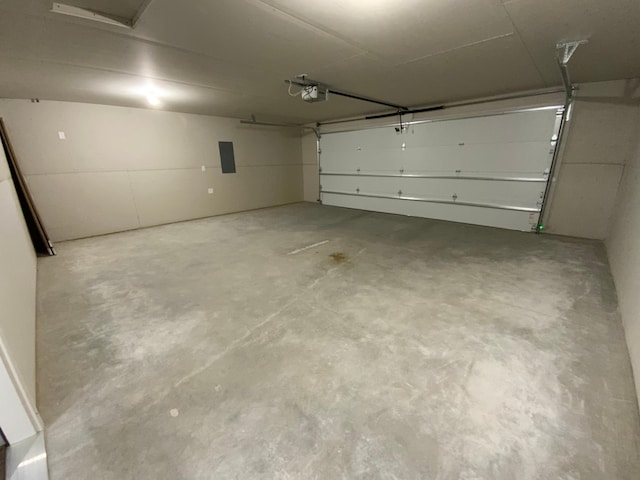 garage with electric panel and a garage door opener