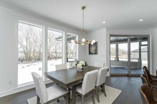 dining room with crown molding, a chandelier, dark wood-type flooring, and recessed lighting