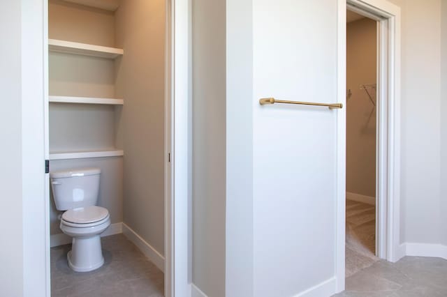 bathroom featuring tile patterned floors and toilet