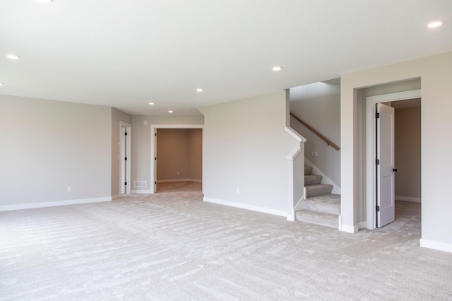 empty room featuring light carpet