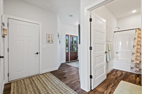 foyer with dark hardwood / wood-style floors