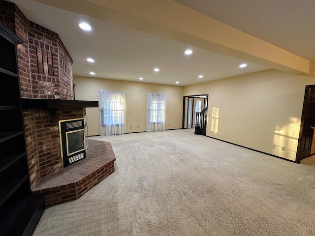 carpeted living room featuring a brick fireplace