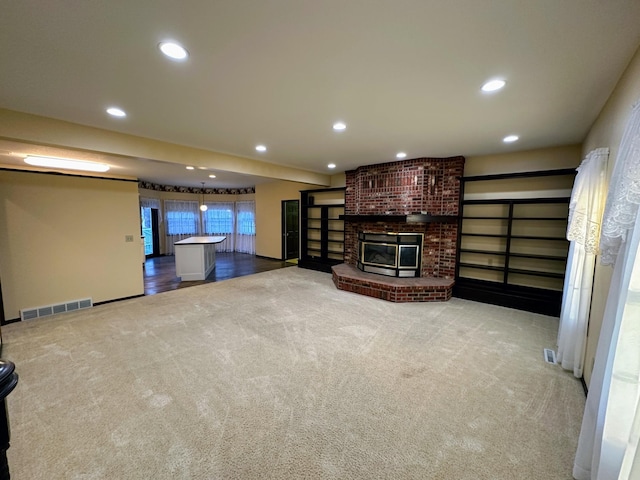 unfurnished living room featuring light carpet