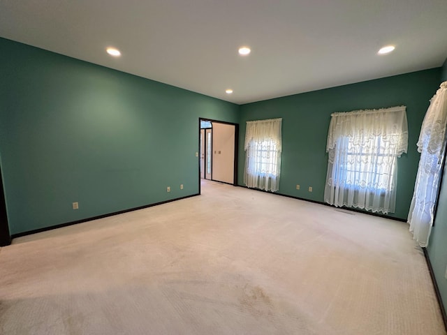 unfurnished bedroom with light carpet