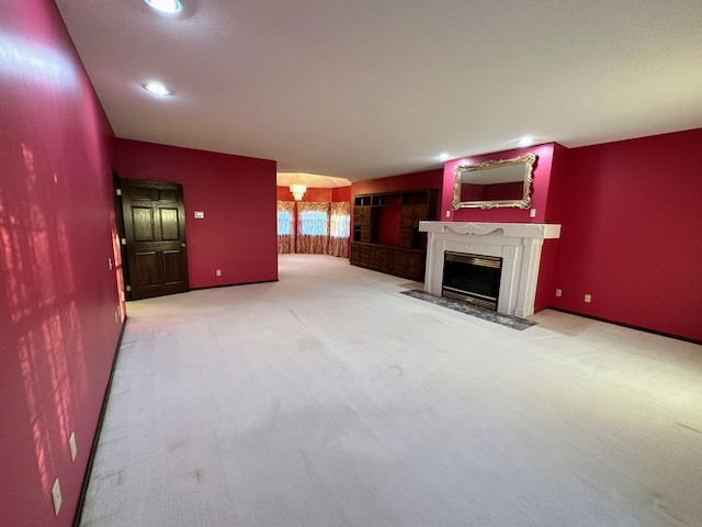 unfurnished living room with light carpet