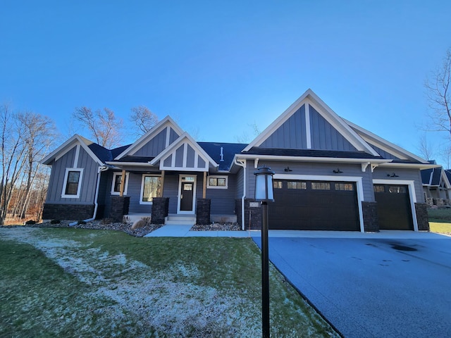 view of front facade with a front yard and a garage