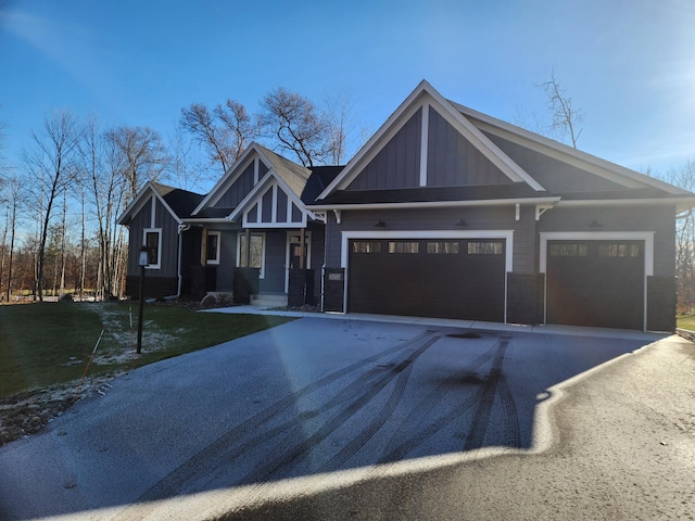 craftsman house with a garage