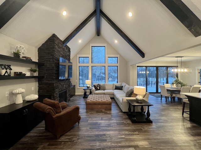 living room featuring a stone fireplace, a notable chandelier, high vaulted ceiling, beamed ceiling, and dark hardwood / wood-style floors