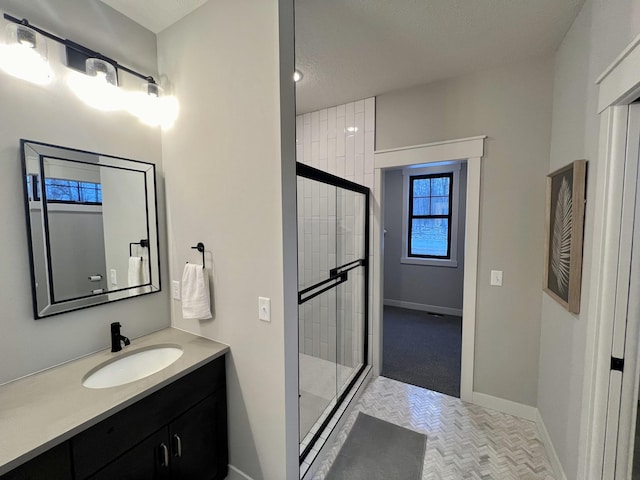 bathroom with vanity and an enclosed shower