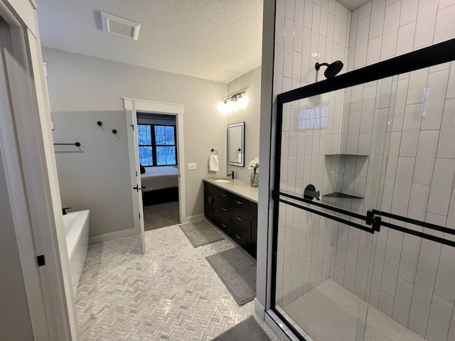 bathroom with tile flooring, vanity, and independent shower and bath