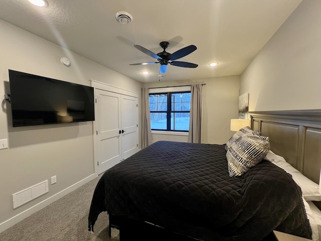 bedroom with ceiling fan and carpet