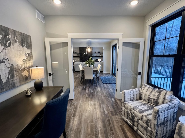 corridor featuring french doors and dark hardwood / wood-style floors