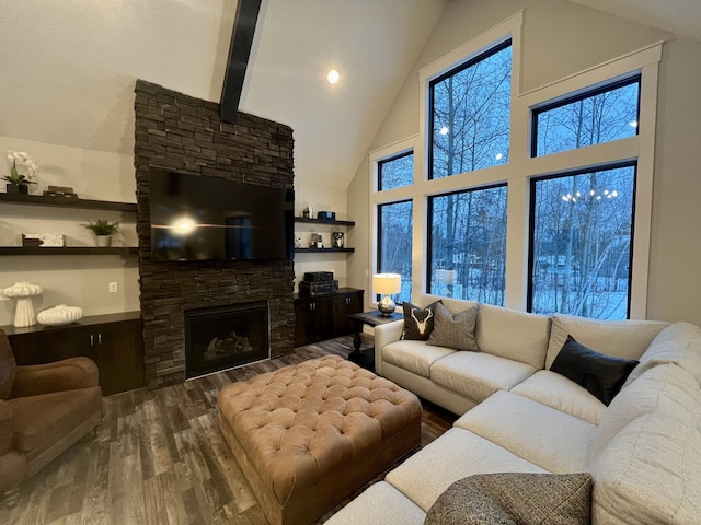 living room with dark wood-type flooring, a fireplace, high vaulted ceiling, beam ceiling, and a healthy amount of sunlight