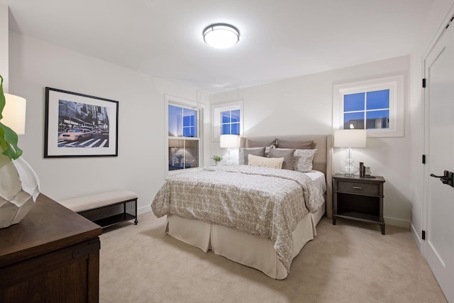 bedroom featuring light colored carpet