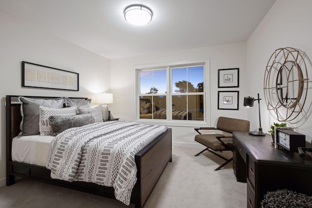 bedroom featuring light carpet