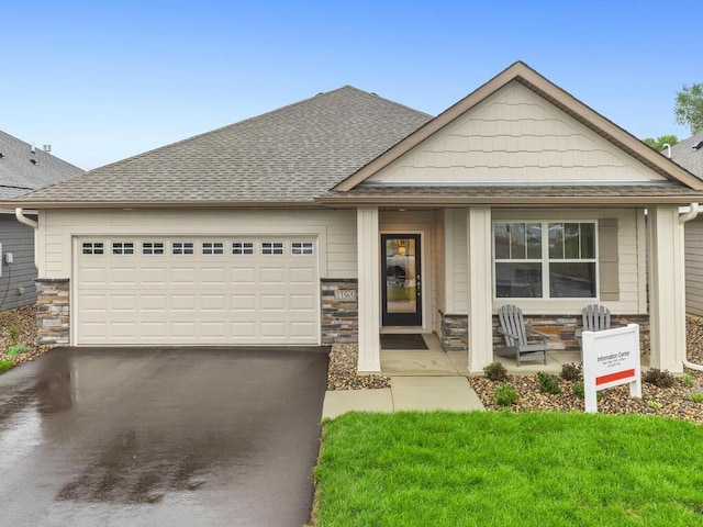 view of front of home with a garage and a front lawn