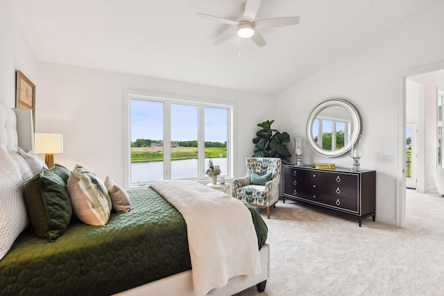 bedroom with access to outside, light colored carpet, ceiling fan, a water view, and lofted ceiling