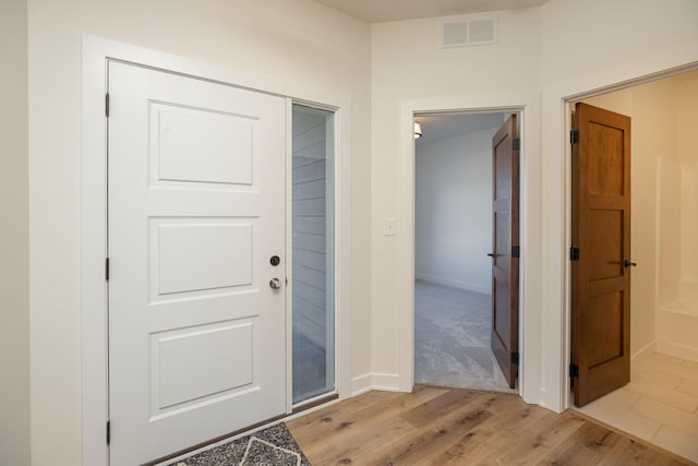 foyer with light wood-type flooring