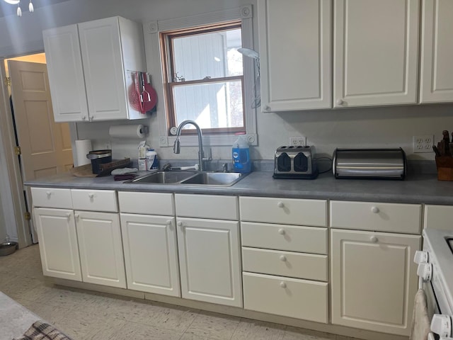 25427 260th St, Callaway, MN 56521 - kitchen with range, white cabinets, and a sink