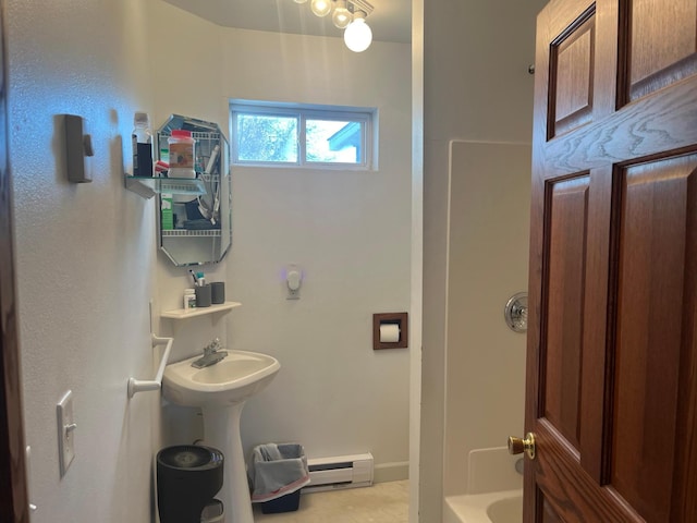 25427 260th St, Callaway, MN 56521 - bathroom with bathtub / shower combination and a baseboard heating unit