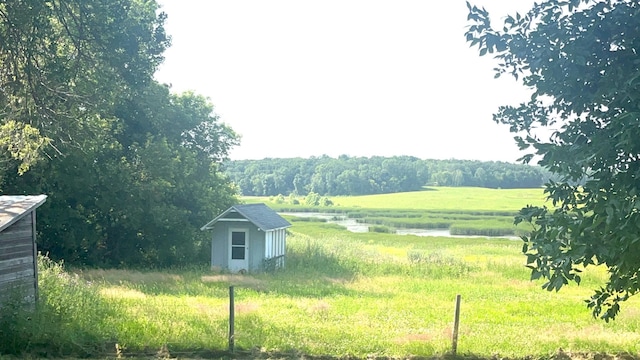 25427 260th St, Callaway, MN 56521 - view of yard featuring an outbuilding, a rural view, and a storage shed