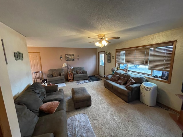 carpeted living room featuring a textured ceiling and ceiling fan